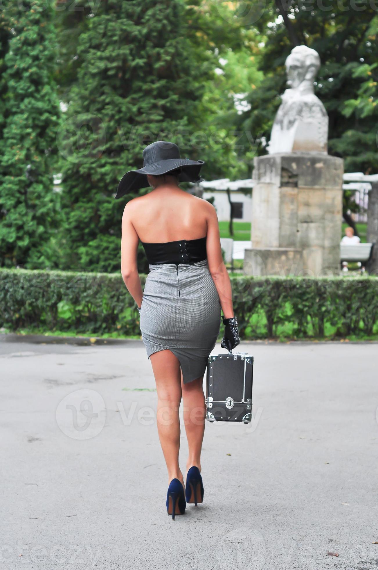 Beautiful Brunette Model Is Having A Vintage Photo Shooting The Woman Is Wearing A Short Skirt