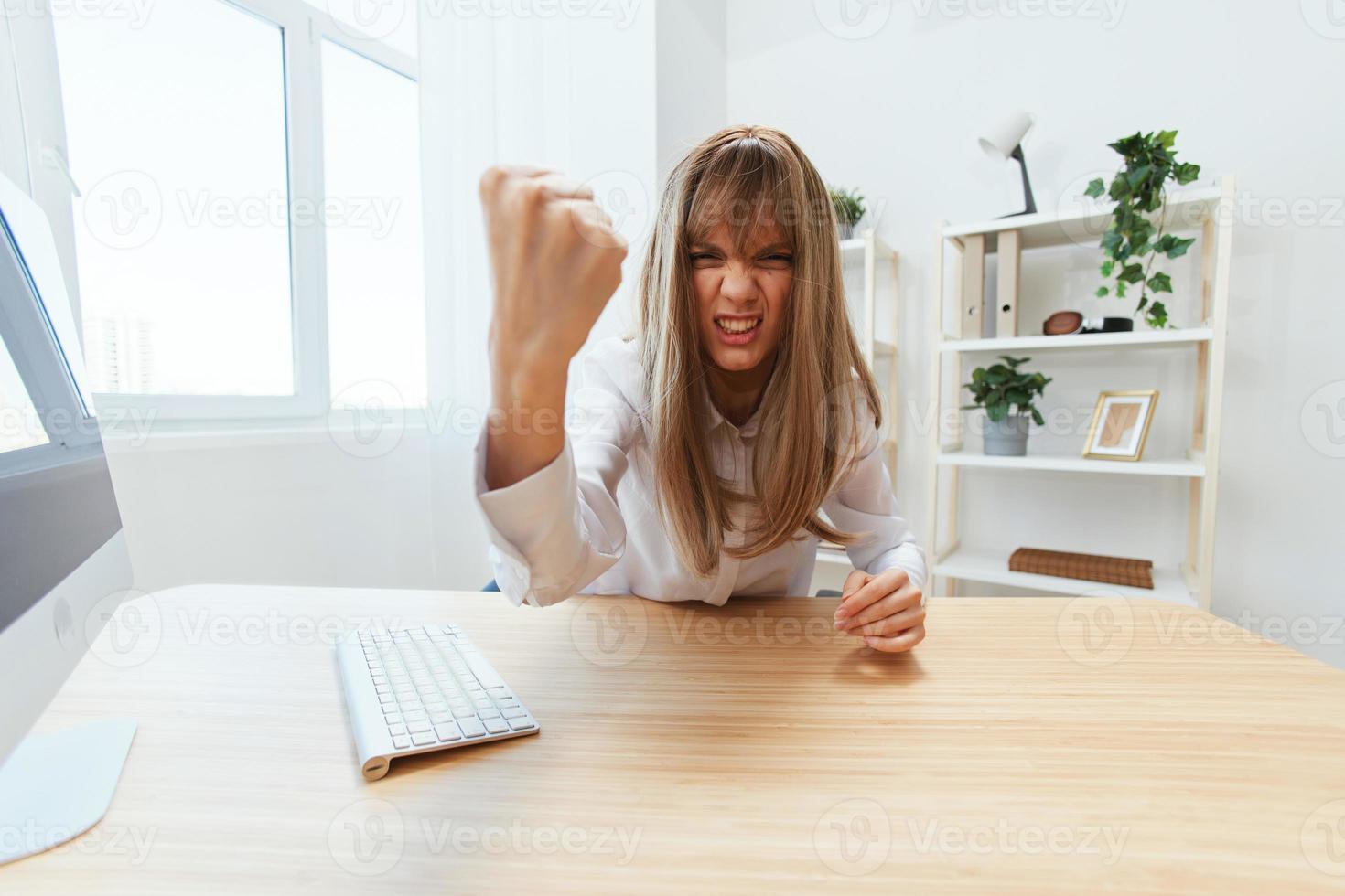Angry Evil Blonde Businesswoman Screaming To Subordinates Shaking Fist At Camera Sitting At