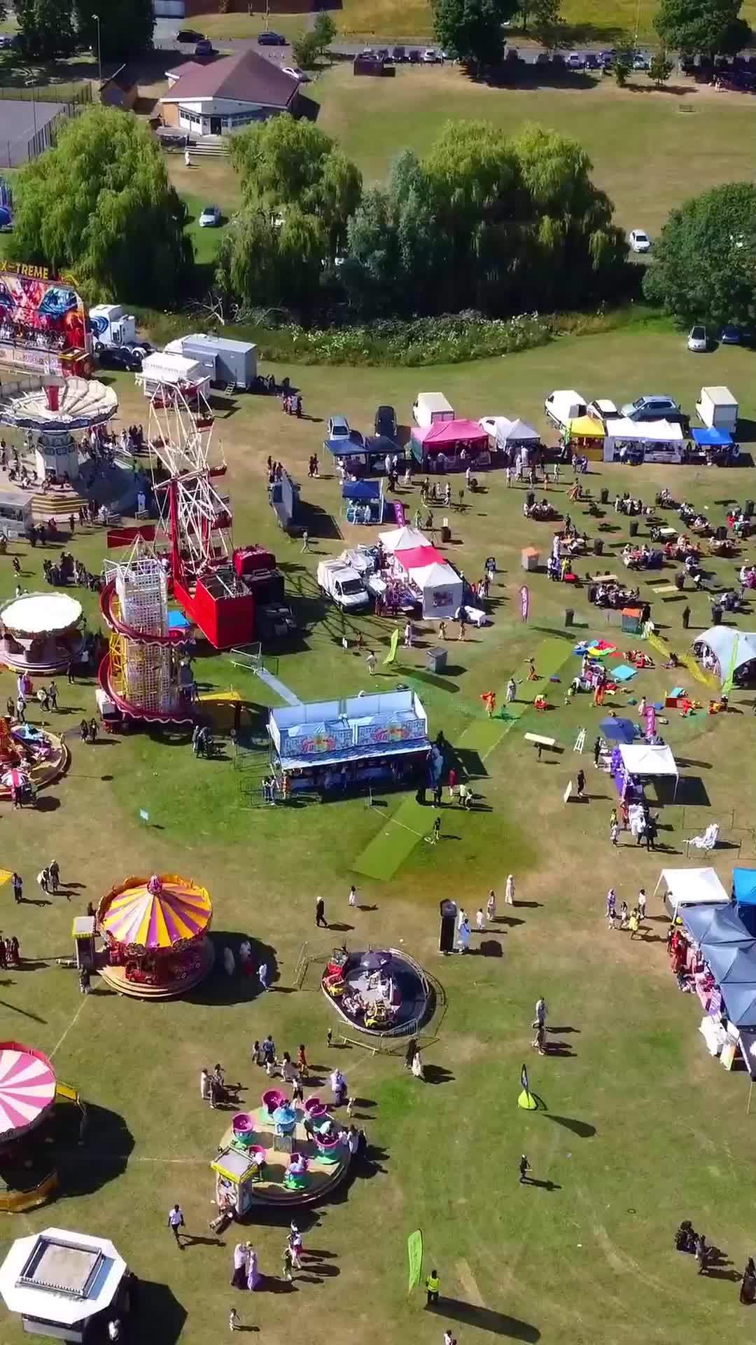 Aerial Footage Of Funfair People Are Enjoying Hot Summer At A Local Public Park Of Luton Town
