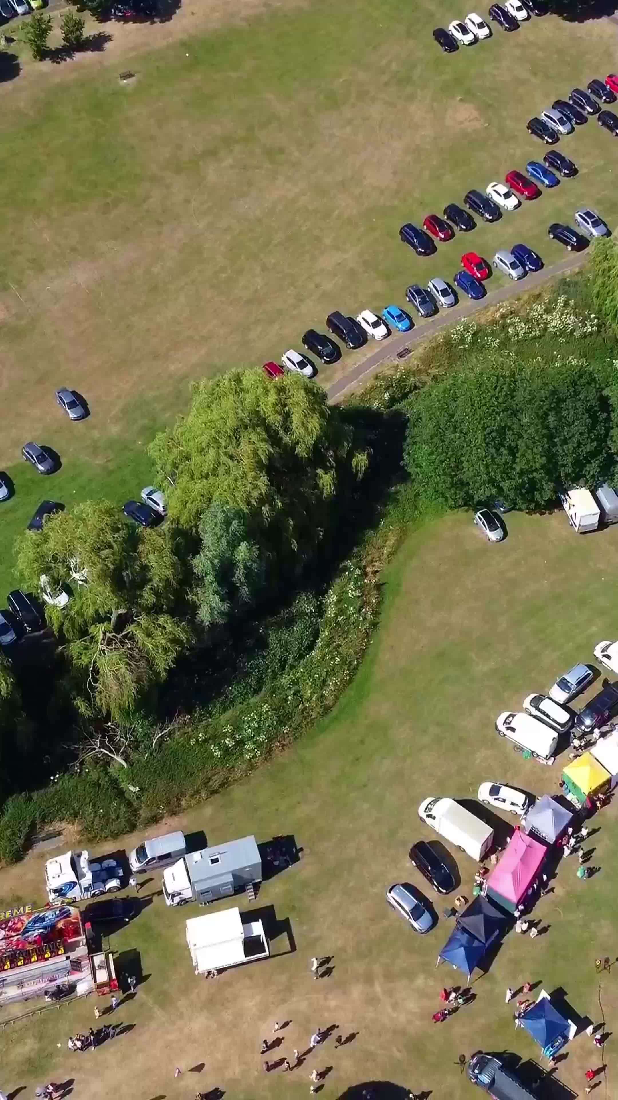 Aerial Footage Of Funfair People Are Enjoying Hot Summer At A Local Public Park Of Luton Town
