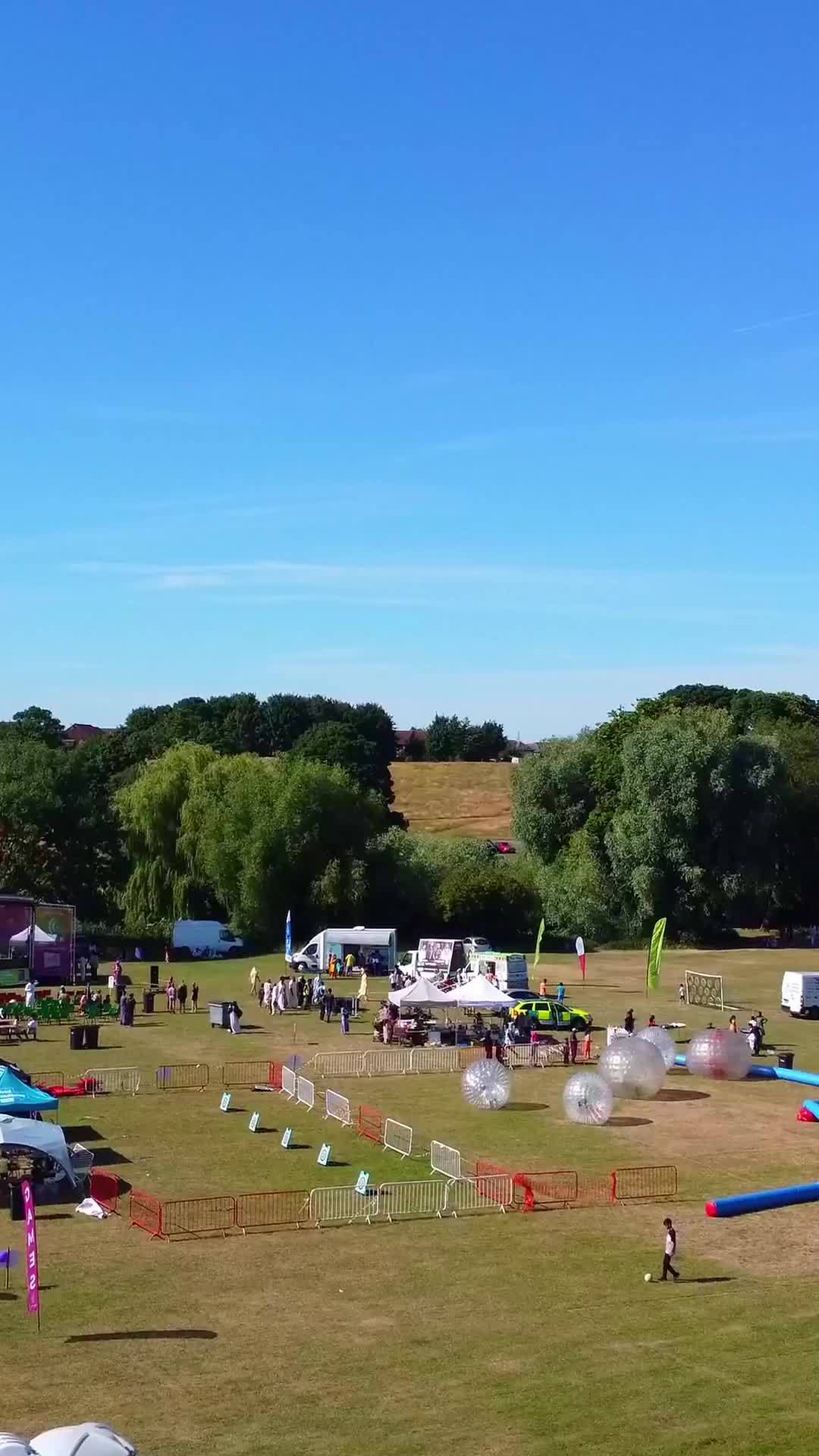 Aerial Footage Of Funfair People Are Enjoying Hot Summer At A Local Public Park Of Luton Town