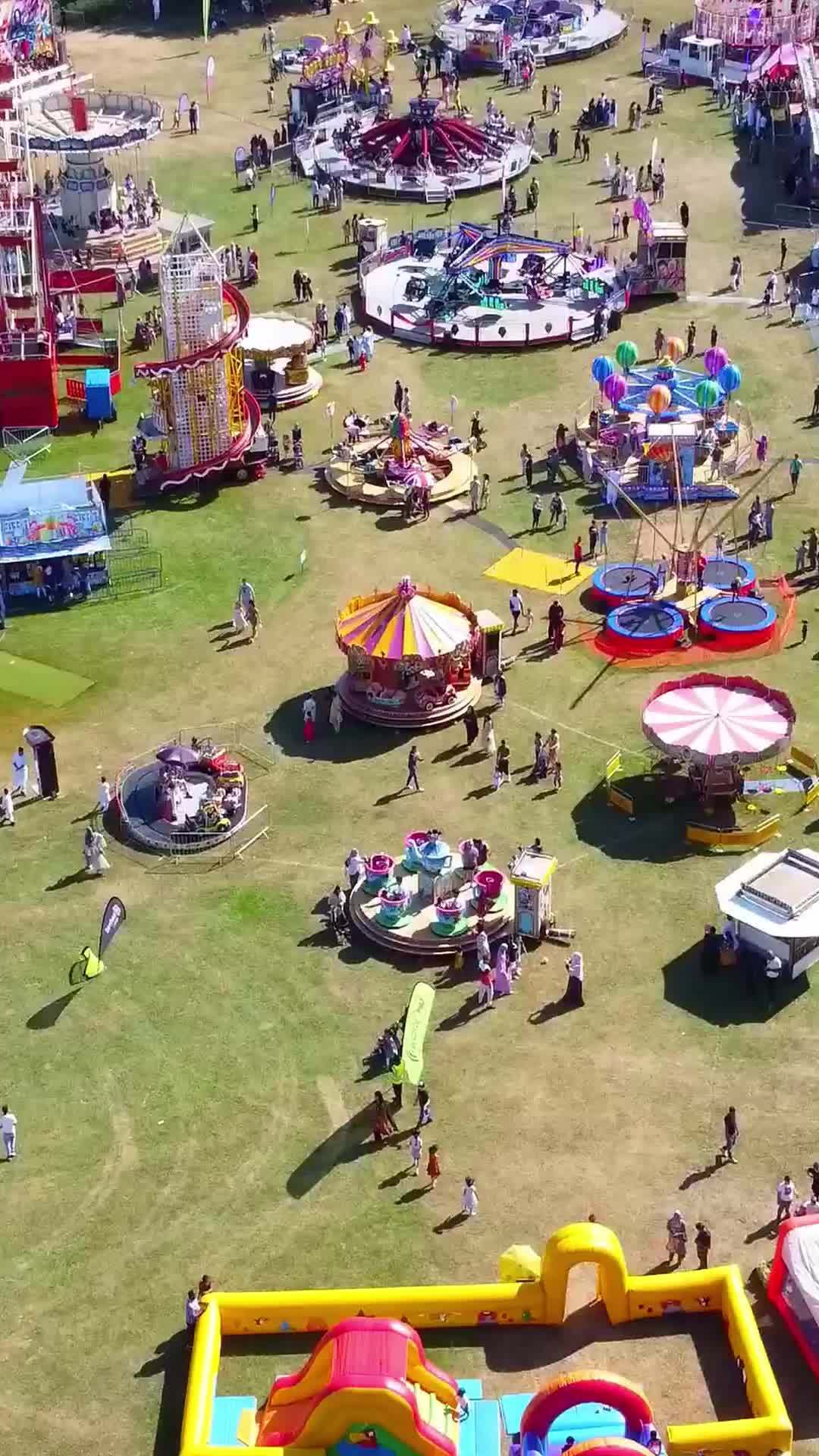 Aerial Footage Of Funfair People Are Enjoying Hot Summer At A Local Public Park Of Luton Town