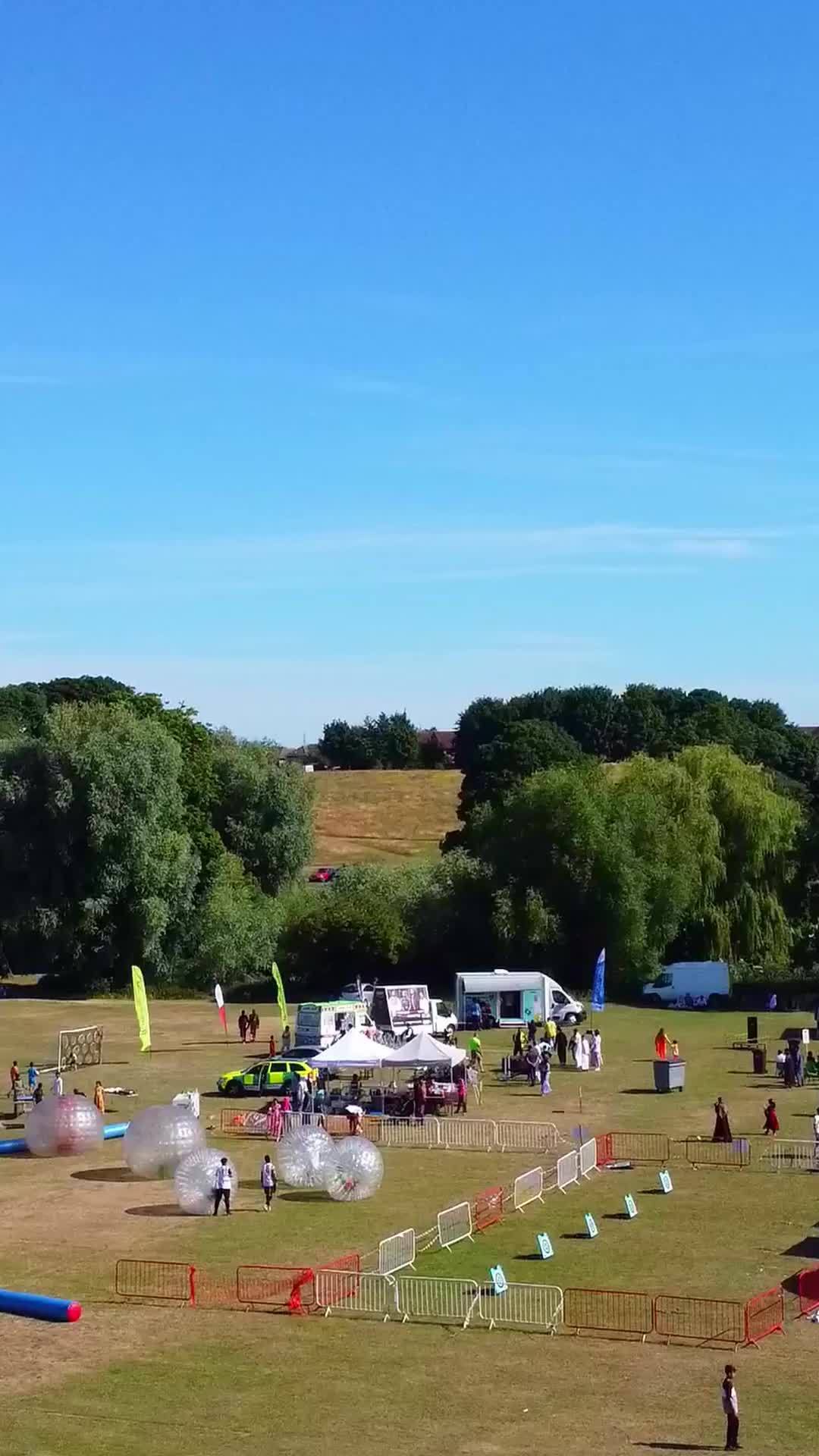 Aerial Footage Of Funfair People Are Enjoying Hot Summer At A Local Public Park Of Luton Town