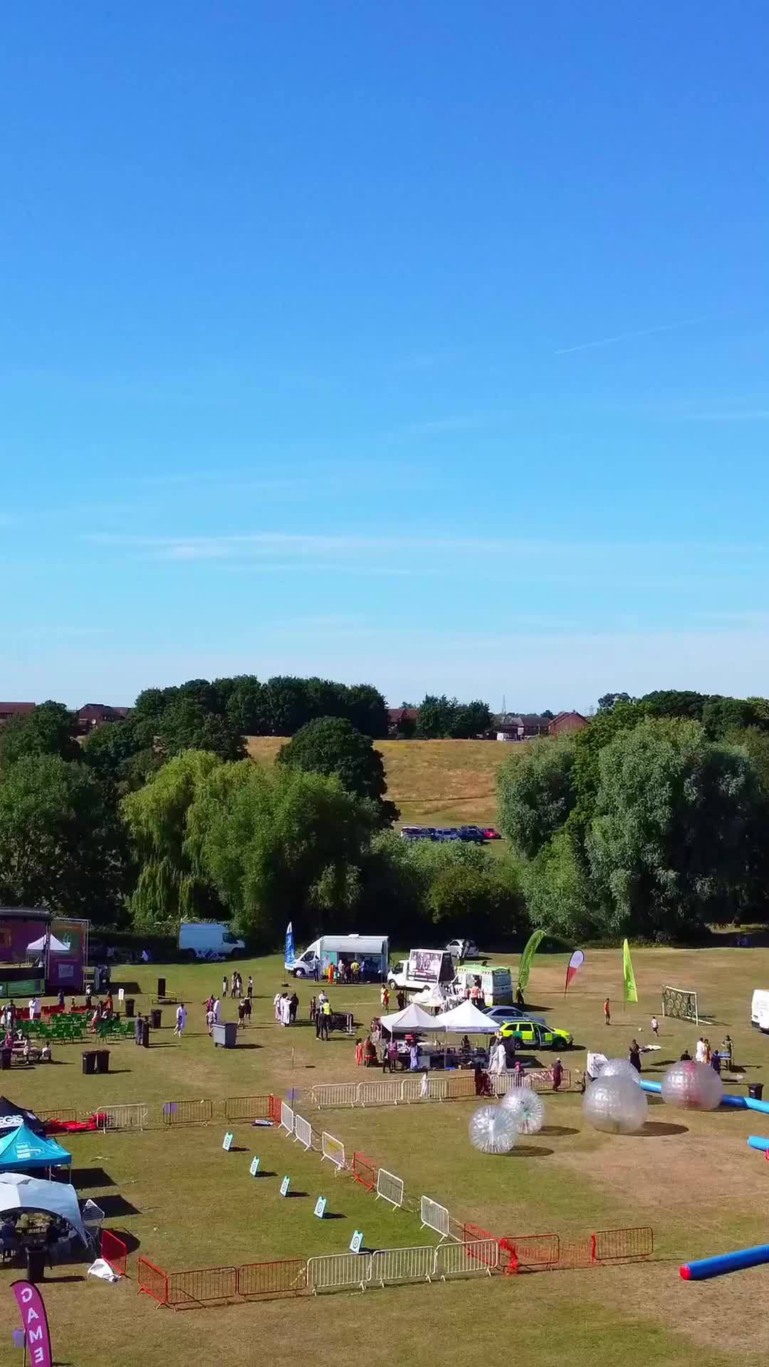 Aerial Footage Of Funfair People Are Enjoying Hot Summer At A Local Public Park Of Luton Town