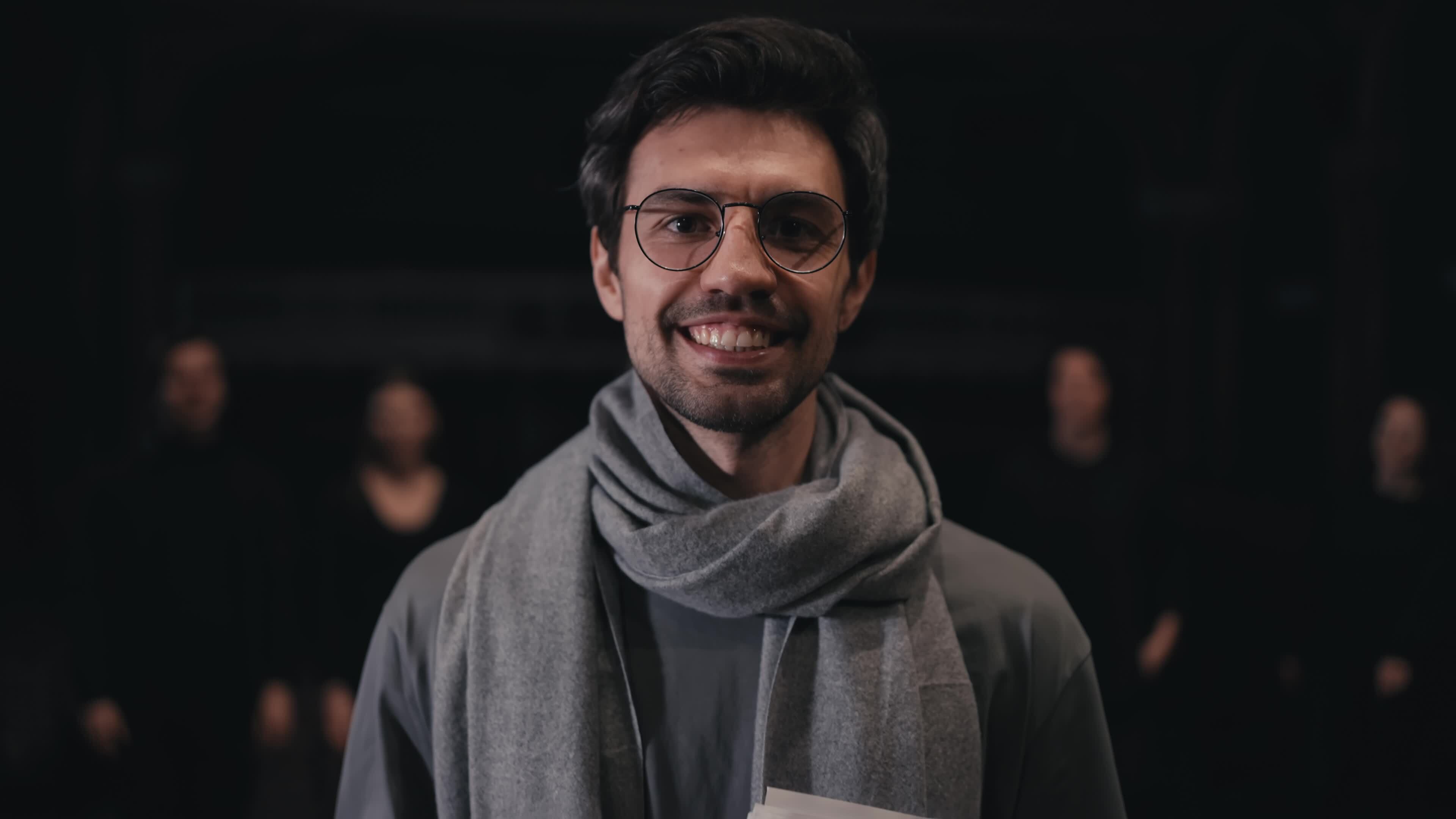 Portrait Of A Confident Brunette Man In Round Glasses Stage Director In