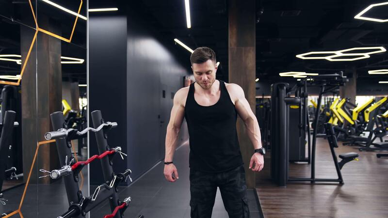 Workout In The Hardcore Gym Sportsman Preparing Training Workout In Gym Ready For Bodybuilding