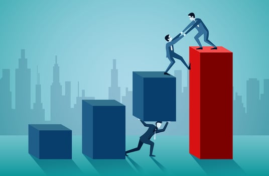 One business man is helping to pull another up on the red bar graph vector