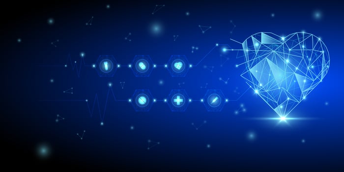 Low poly glowing heart and medical icons vector