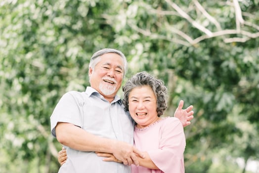 Senior couple embracing outside photo