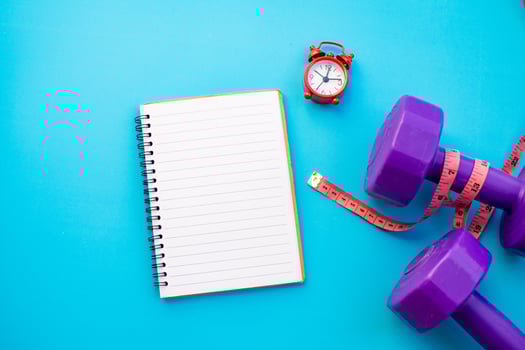 Notebook and fitness equipment photo