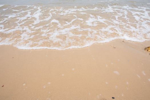 Beach sand and wave photo