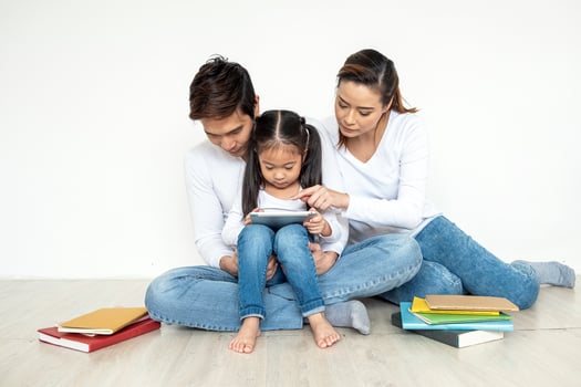 Asian family using tablet together photo