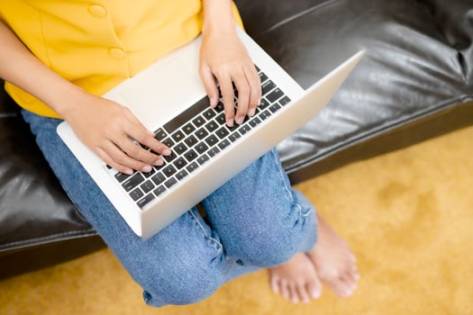 Woman typing on computer photo