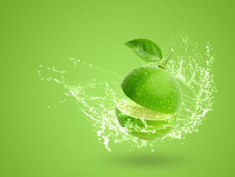 Water splashing on fresh green lime  photo