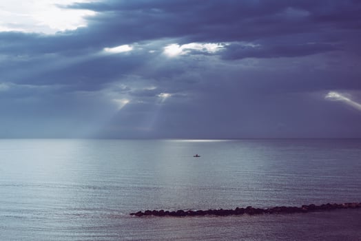 Ocean with cloudy sky photo