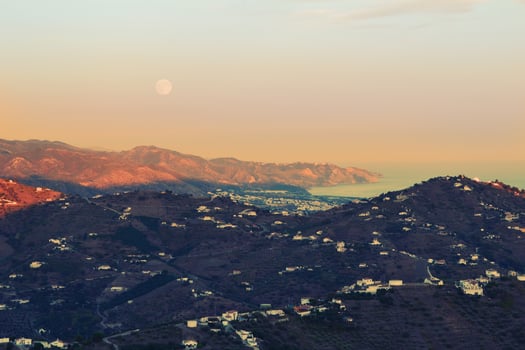 Mountains and moon at golden hour photo