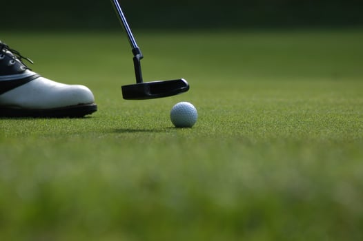 Person playing golf photo