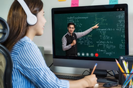 Rear view of Asian student learning online photo