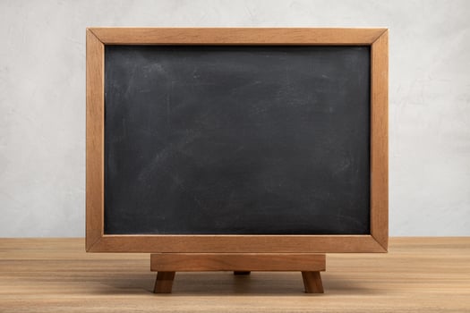 Blank school chalkboard on table photo