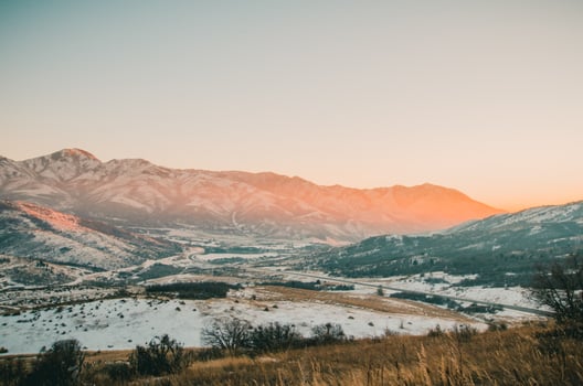 Sunrise on snowy mountains photo