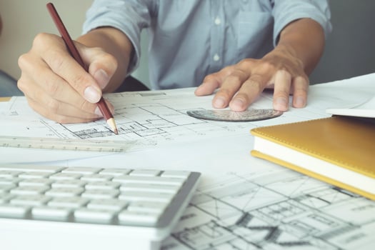 Close-up of architect working on a blueprint photo