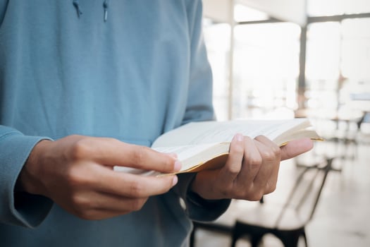 Close-up of a man reading a book photo