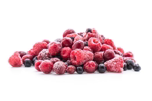 Frozen berry mix on white background photo