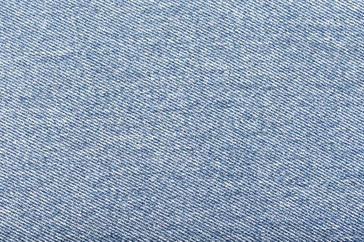 A close-up of light blue denim fabric photo