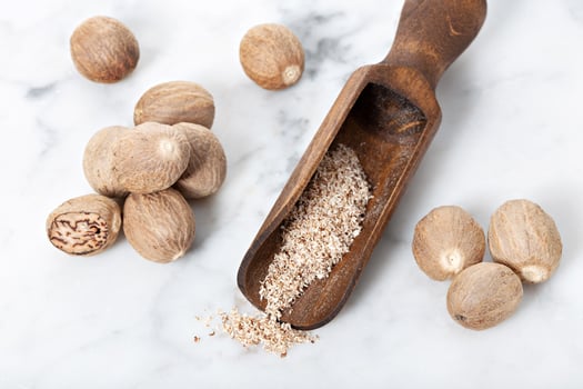 Nutmeg and in a wooden scoop photo
