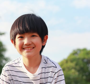 Happy boy in a park photo