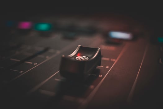 Close-up of a sound mixing board photo