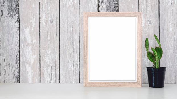 Wooden picture frame mockup with a cactus photo