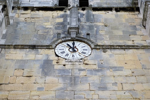 Clock on the wall of a church photo