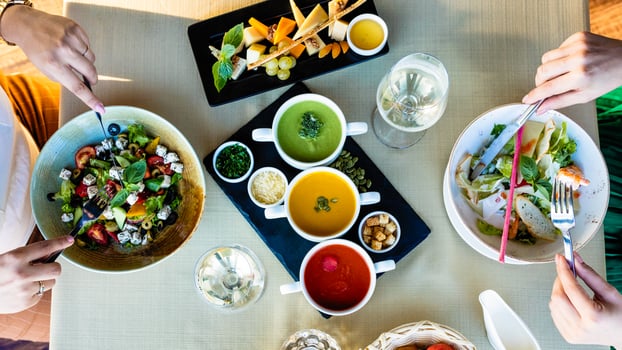 Eating chicken salad with different soups photo