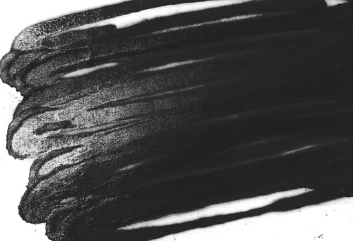 Black spray paint texture on white background  photo