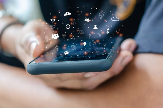 Hand holding  smartphone with icons photo
