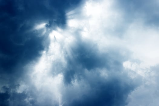 Sun rays shining through the clouds  photo