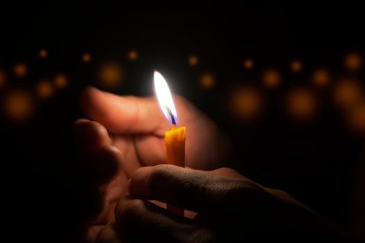 Man holding a candle photo