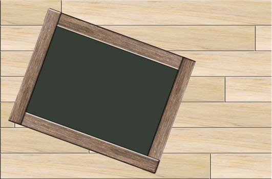 Blackboard on wooden background photo
