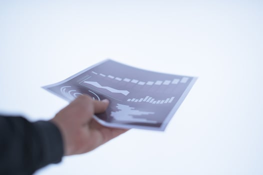 Hand holding a document photo