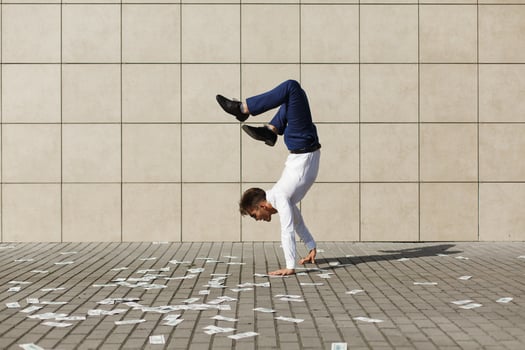 Man doing handstand on the street photo