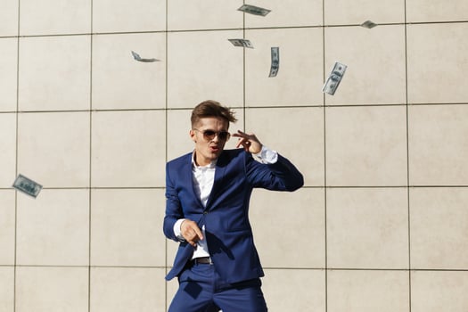 The guy dancing with dollars photo