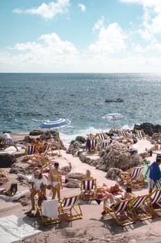 Naples, Italy, 2019-Tourists sunbathe off the coast of Capri photo
