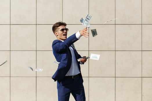Man throwing money around photo
