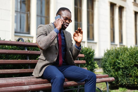 African American business man talks on the phone photo