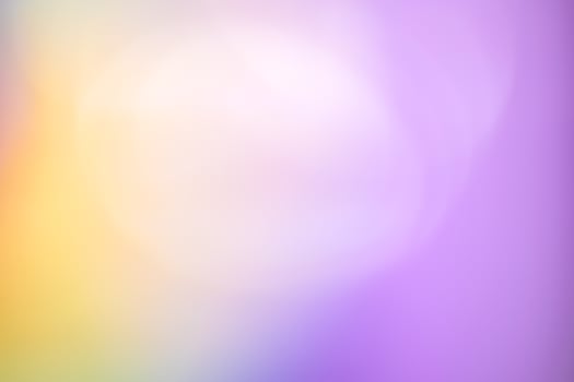 A blurry purple and yellow background with a blurred image photo