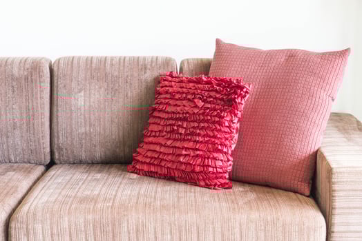 Couch with pink pillows photo