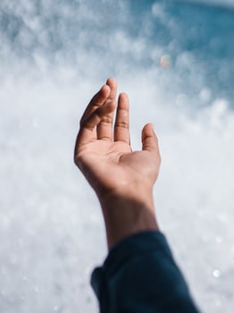 Hand in front of a wave photo