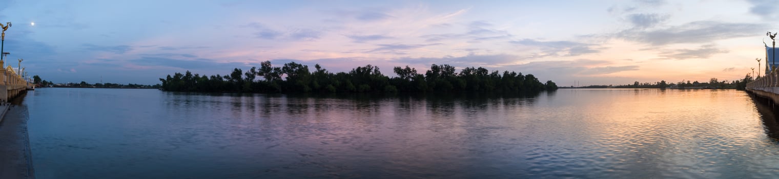 Island with trees at sunset photo