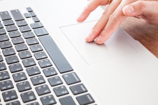 Close-up of a person using a laptop photo